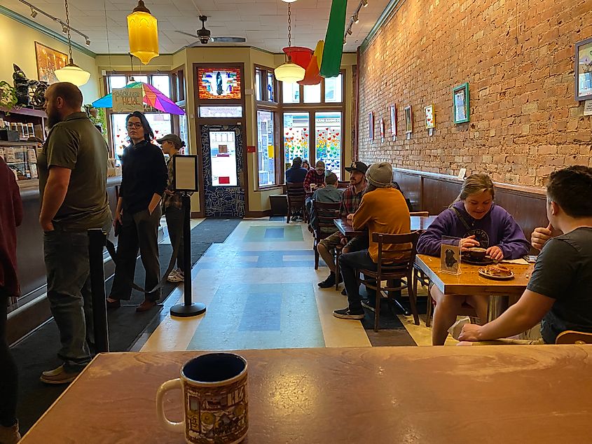 A POV pic from inside a cozy, artsy cafe.