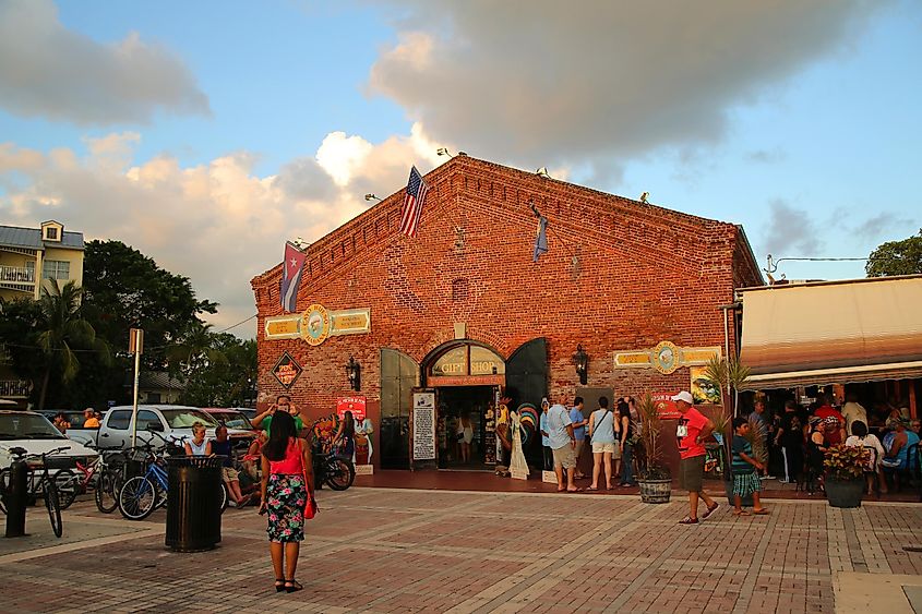 Tourists at Mallory Square during the "Sunset Celebration", which is considered one of the main tourist attractions of the city of Key West, Florida, via Leonard Zhukovsky / Shutterstock.com