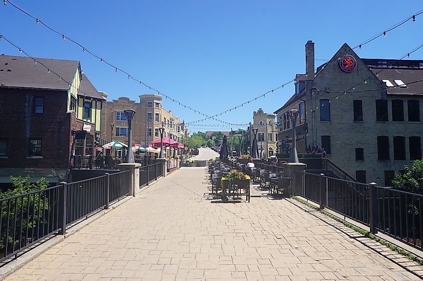   1 ⁄ 1  More details A pedestrian bridge and the Buckatabon and Café Hollander patio in Wauwatosa, Wisconsin.