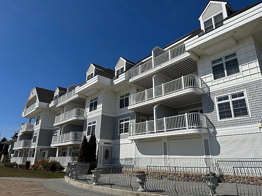 Exterior of Water's Edge Resort and Spa with balconies, via Rachel Rose Boucher / Shutterstock.com