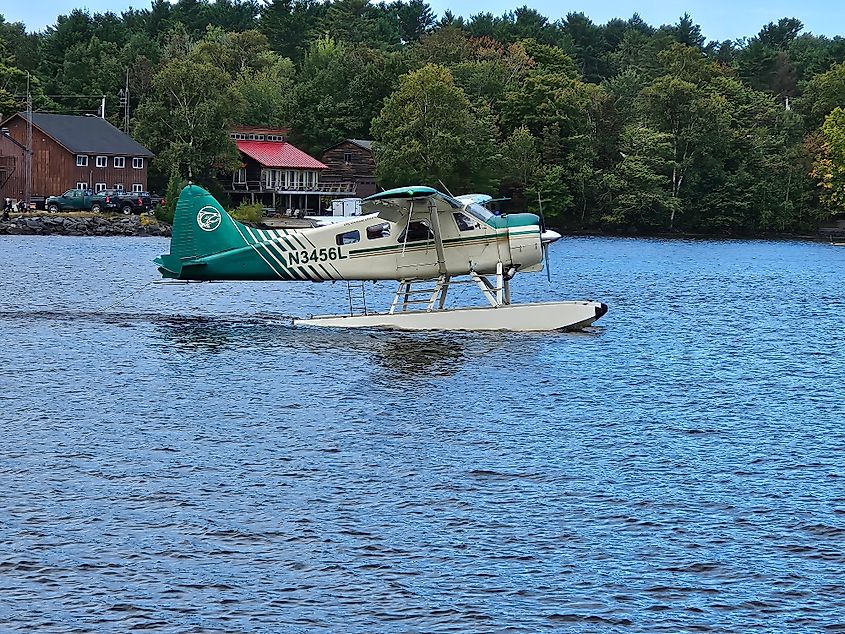 A seaplane landing on Moosehead Lake in Greenville, Maine