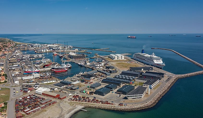 An aerial view of the port of Skagen and cruise terminal with P&O Aurora berthed alongside the dock on a sunny summer day