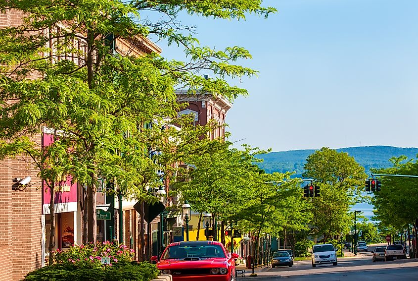 The view to the north down Howard St affords a glimpse of Little Traverse Bay off Lake Michigan, a setting that makes this quaint town a popular coastal resort.