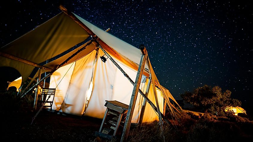 Gorgeous glamping canopy tent at night under the stars in Southern Utah near Moab