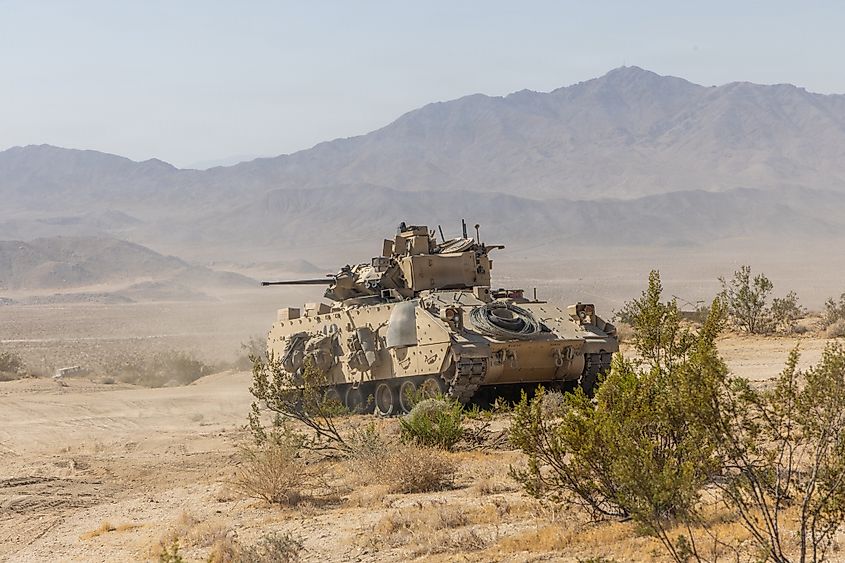 An M1A2 Systems Enhanced Package Abrams tank assigned to 4th Infantry Division holds position during Project Convergence Capstone 6 (PC-C6) at Fort Irwin, California. Editorial credit: Faizinraz / Shutterstock.com