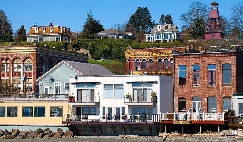Port Townsend, Washington waterfront view of old Victorian era architecture on a clear sunny day with blue sky. 