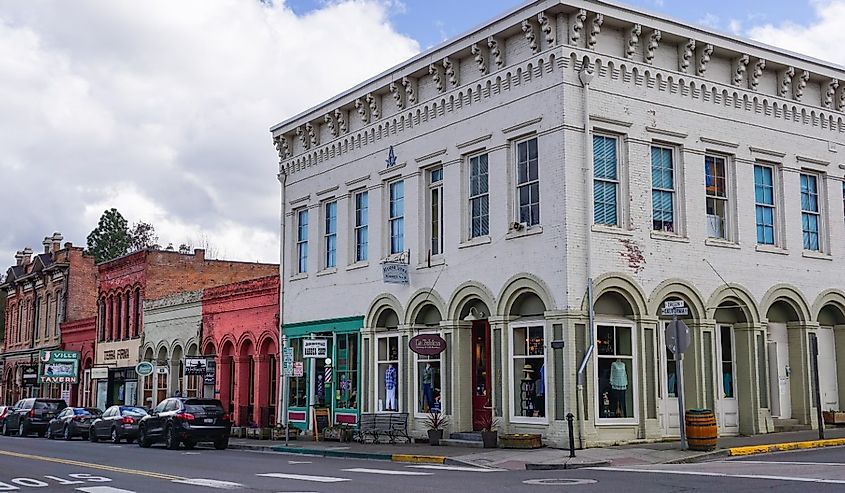 Downtown Historic District brick buildings with 1874 Masonic Lodge, foreground, corner of California and Oregon Streets, old 19th century construction in Jacksonville, Oregon