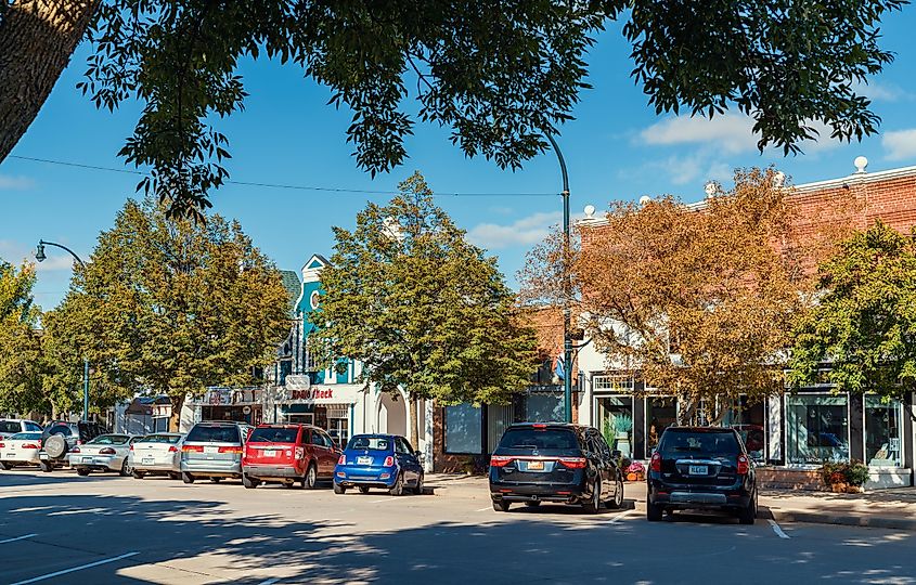 Cars parked in front of shops along Central Avenue in downtown Orange City, Iowa.