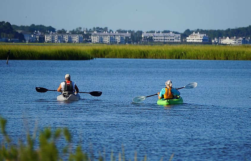 A couple on a kayak by the bay near Bethany Beach, Delaware, U.S