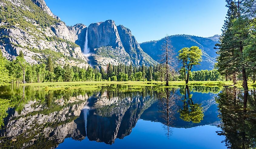 Yosemite National Park reflected in Merced River of Yosemite waterfalls and beautiful mountain landscape