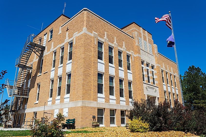 Chadron, Nebraska - July 25, 2014: The Flag Flies in Front of the Dawes County Courthouse, via davidrh / Shutterstock.com