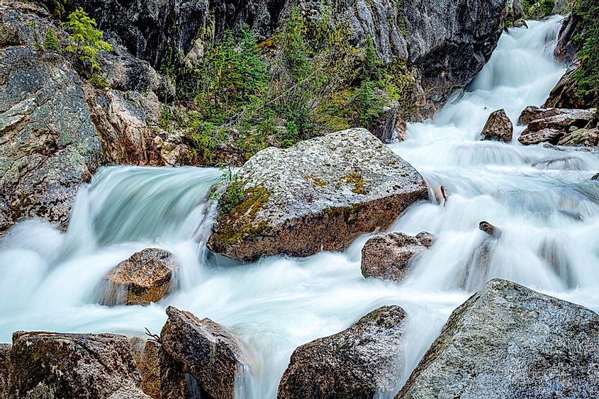 Idaho waterfall flows over rocks as it descends through a canyon
