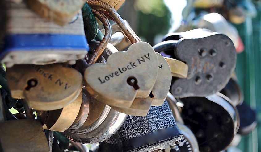 Lovelock, Nevada, USA - Selective focus. Lovers Lock Plaza in the shaded area at the back of the Court House where couples symbolise their love by attaching a padlock to an “endless chain.”