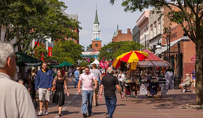 People on Church Street, a pedestrian mall with sidewalk cafes and restaurants.