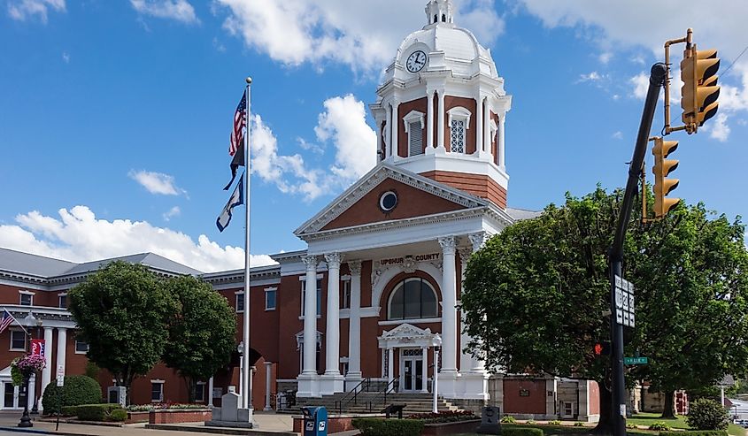 Flags fly in front of the Upshur County Court House in Buckhannon West Virginia