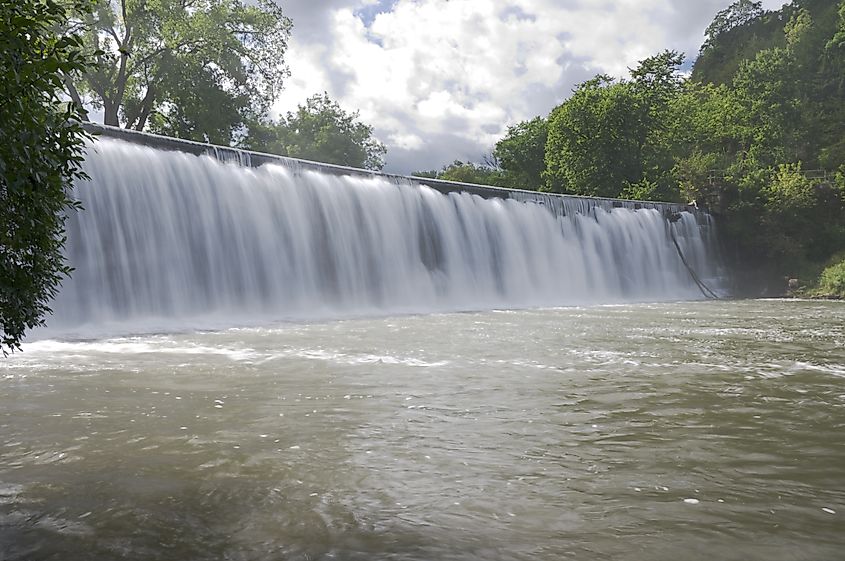 Rushing waters at base of Root River dam and waterfall in Lanesboro Minnesota