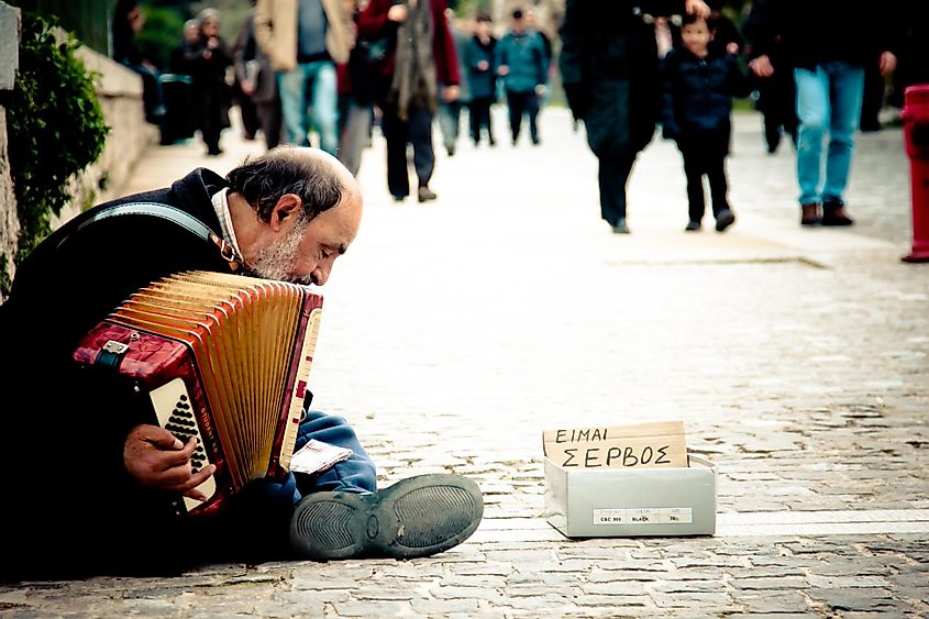 Man playing the accordian on the streets of Greece