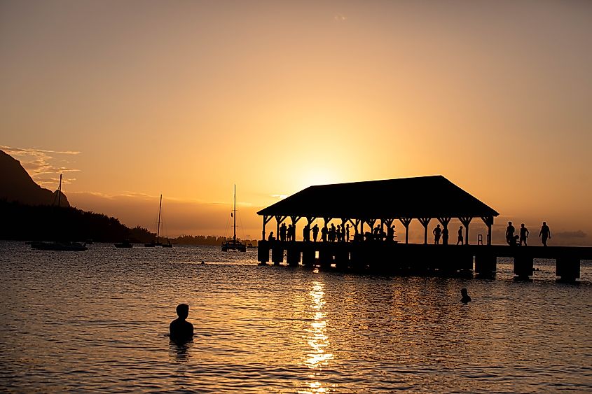 Fishing and gathering at Hanalei Pier in Hanalei Bay, Hawaii.
