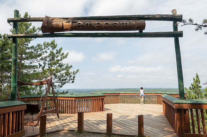 Tourists enjoy the view from the entrance of Temagami Fire Tower in Temagami, Ontario