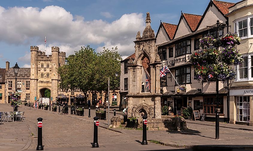 Historic buildings line the main street of Wells, England.
