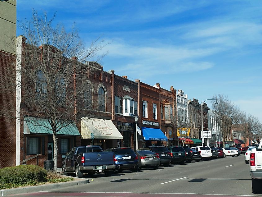 Main street of Norman, Oklahoma lined with old brick buildings