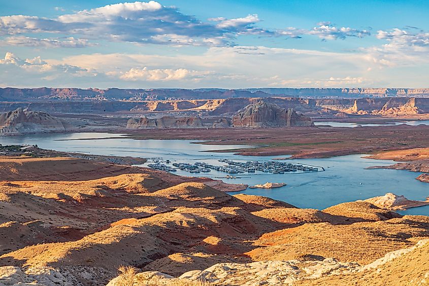 Lake Powell's red sandstone canyon walls above the water.