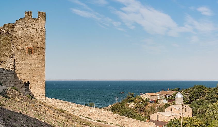 Medieval fortress of Kafa on the shore of the Gulf of Feodosia. Tourist attraction of the resort town. 