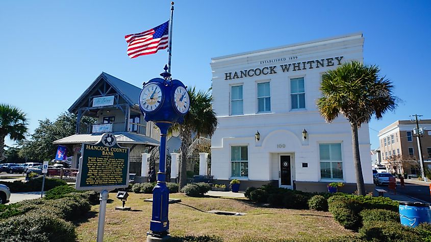 Bay of St. Louis, Mississippi, along Main Street, featuring the prominent bank building and old clock.