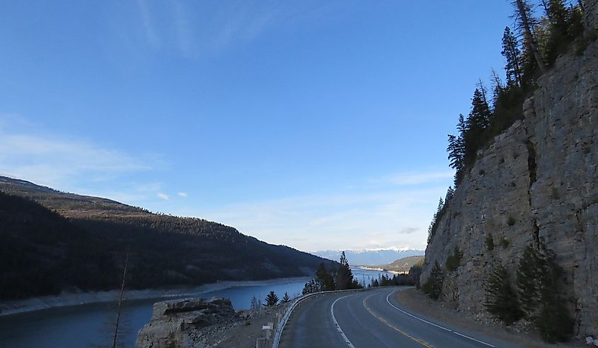 Road leading into Eureka Montana alongside the water.