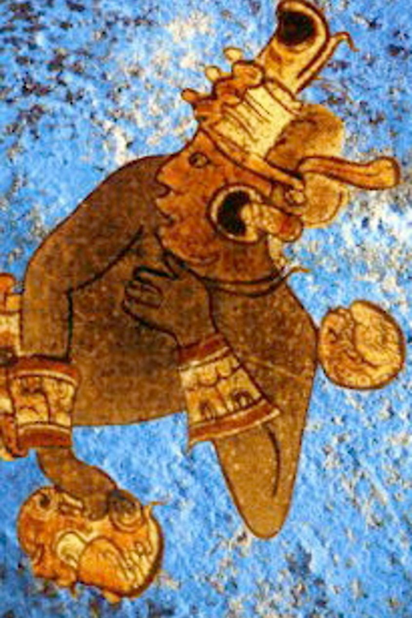 A warrior with Azul Maya on the background and an example of Maya blue dye.