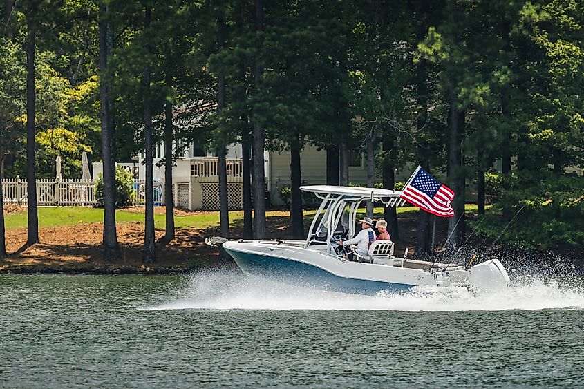 Boaters on a fishing boat on the lake in Greensboro, Georgia.