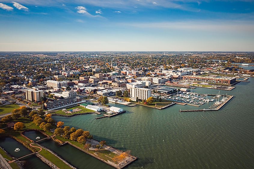 Serene harbor scene with docked boats near downtown Sandusky, Ohio, on an autumn day. 