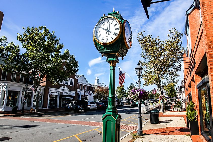 Downtown in nice day with clock, store fronts, restaurant and blue sky on Elm Street, via Miro Vrlik Photography / Shutterstock.com