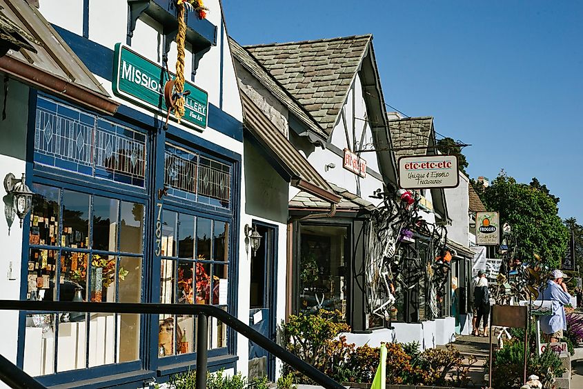 A row of tourist shops bathed in sunlight in Cambria, California, USA.