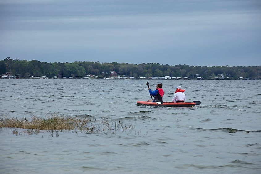 Family kayaking at Kingsley Lake in Starke, Florida.