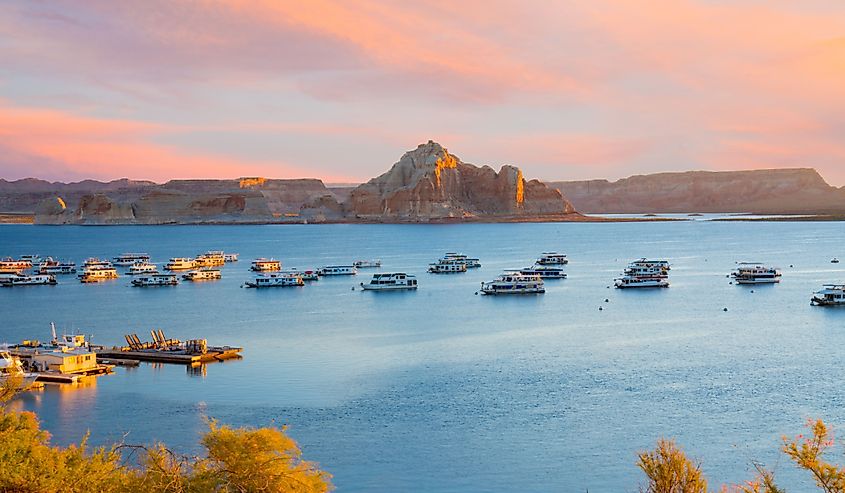  Houseboats during sunrise near Wahweap Marina on Lake Powell in Page, Arizona.