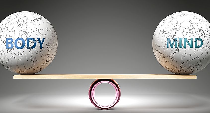Body and mind in balance - pictured as balanced balls on scale 