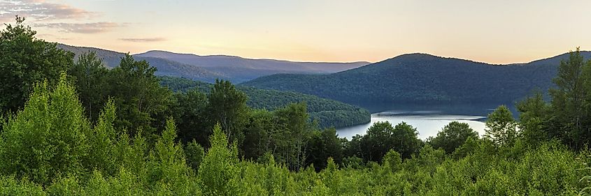 View of the Pepacton Reservoir and Catskills Mountains at sunset from the Shaverton Trail overlook in Andes, New York.
