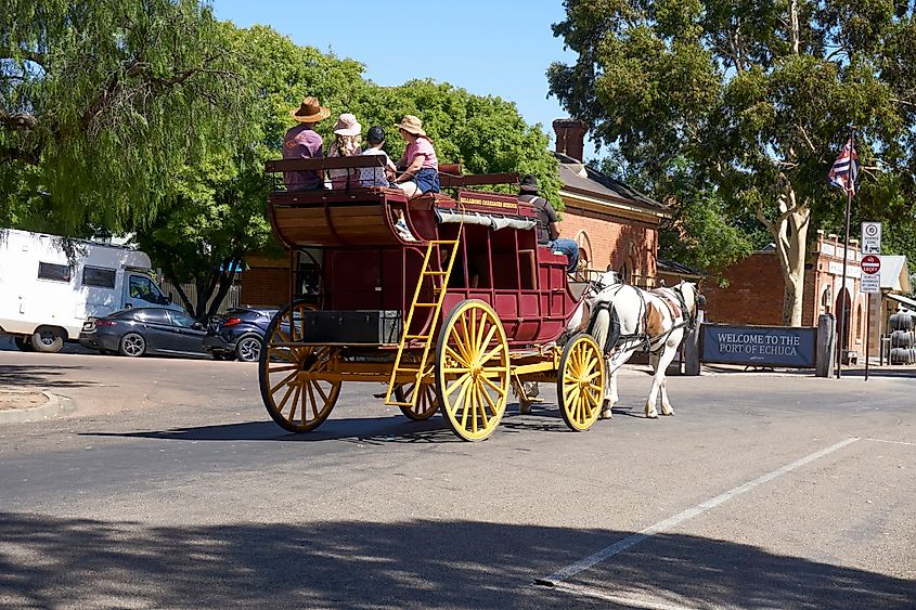 Tourists exploring Echuca, Victoria, Australia, on a stage coach