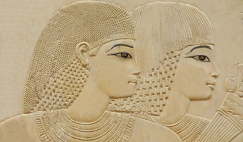 Portrait of beautiful young couple in an ancient egyptian tomb