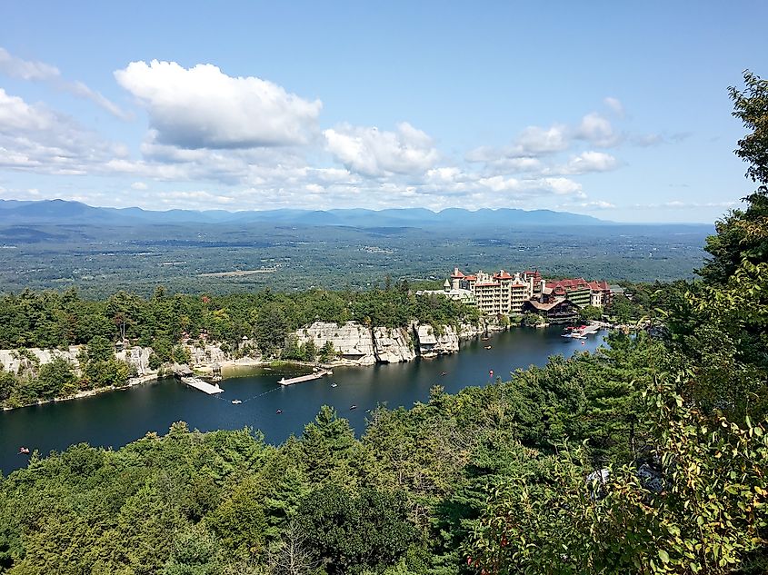 Aerial view of Mohonk Mountain House and lake with mountains in the background in New Paltz, New York