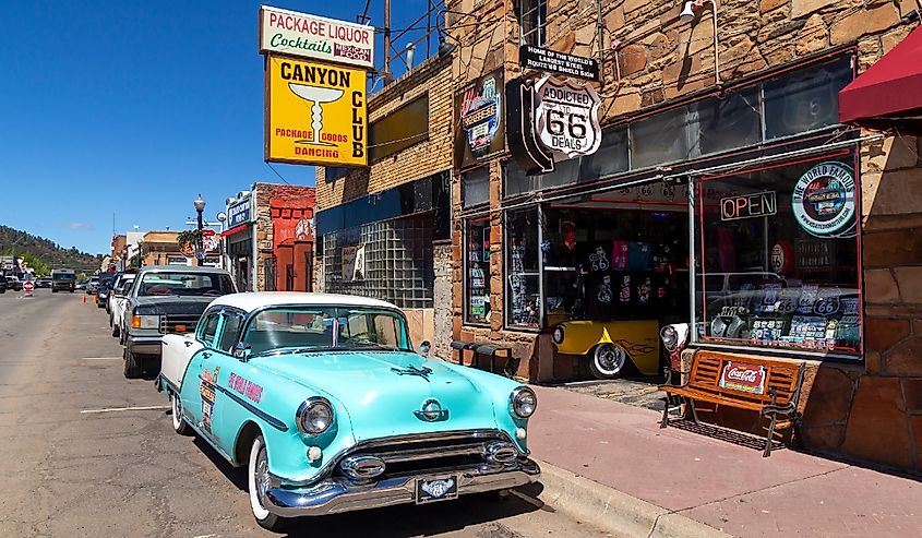 Street scene with classic car in front of souvenir shops in Williams, one of the cities on the famous route 66