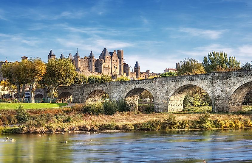 Carcassonne and the Le Pont Vieux bridge viewed from across the Aude river. Southern France