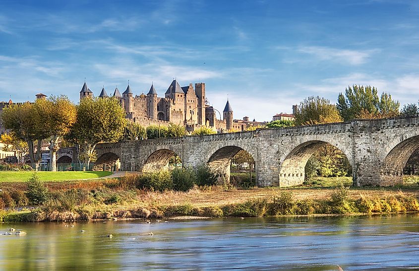 Carcassonne and the Le Pont Vieux bridge viewed from across the Aude river. Southern France