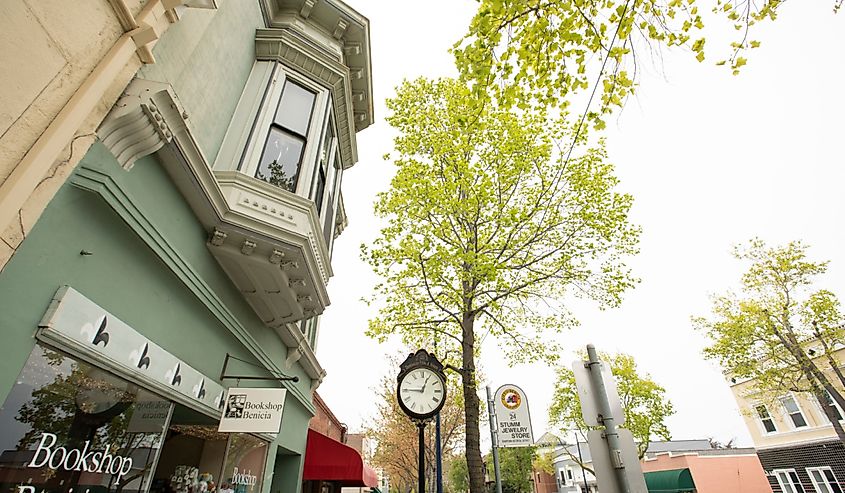 Afternoon foggy sunlight shines on historic downtown Benicia buildings, California