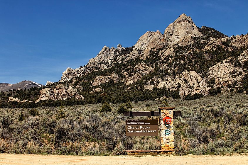 The front entrance sign and granite formations in the City of Rocks National Reserve near Oakley, Idaho.