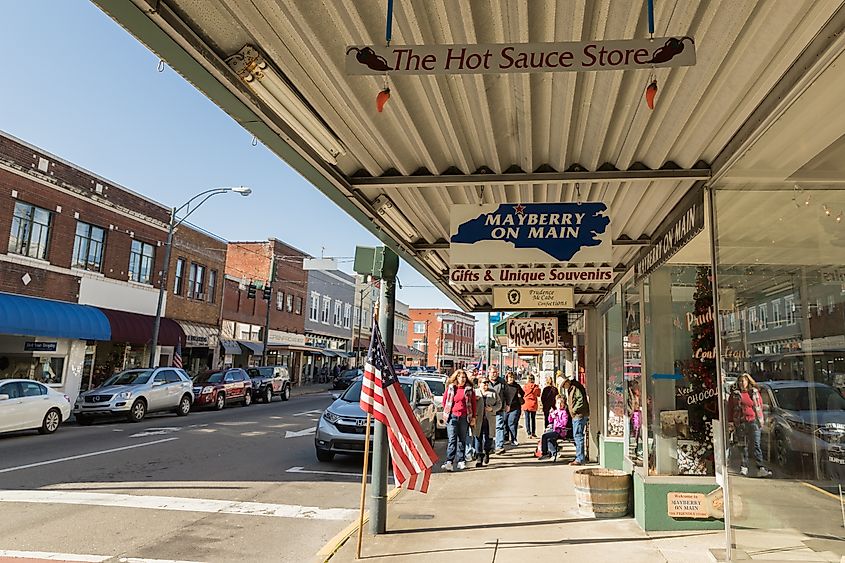 A group of tourist stroll down Main Street of Mount Airy.