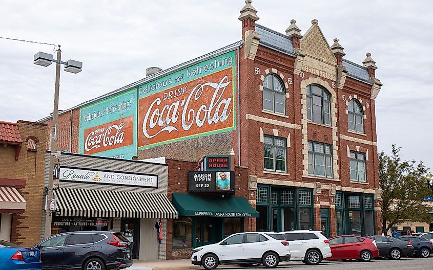 McPherson Opera House with colorful exterior and pale sky. 