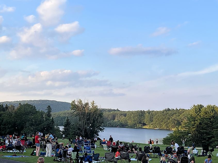 Guests await 4th of July fireworks at Skytop Lodge, Pennsylvania. Revelers enjoyed food, games, and music.
