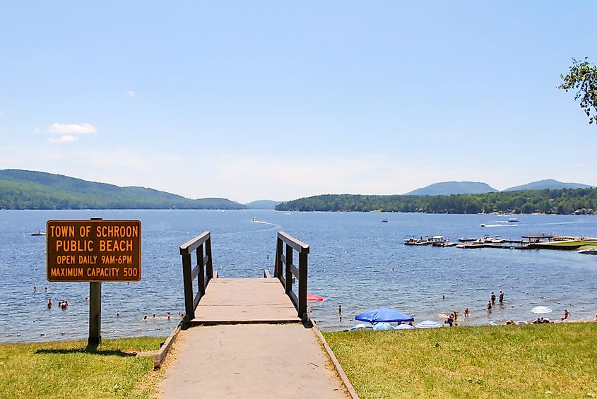 People in the water at Schroon Lake town Beach, New York.